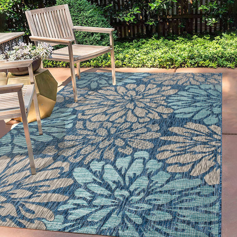 Jonathan Y floral textured weave rug with navy aqua zinnia pattern for outdoor high-traffic spaces.