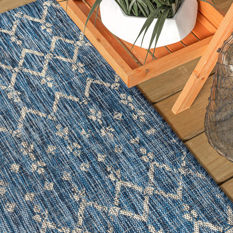 Jonathan Y Ourika handwoven-look rug adding vintage charm to a deck.