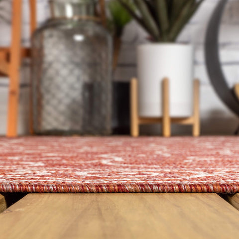 JONATHAN Y Vibrant red and tan palette complements outdoor furniture.
