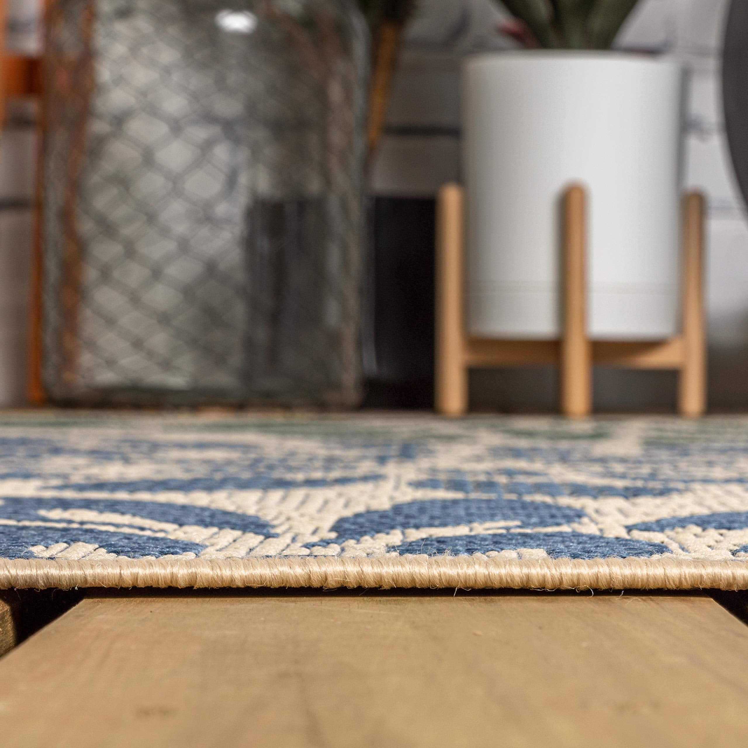 Jonathan Y indoor/outdoor rug shown in a backyard setting.