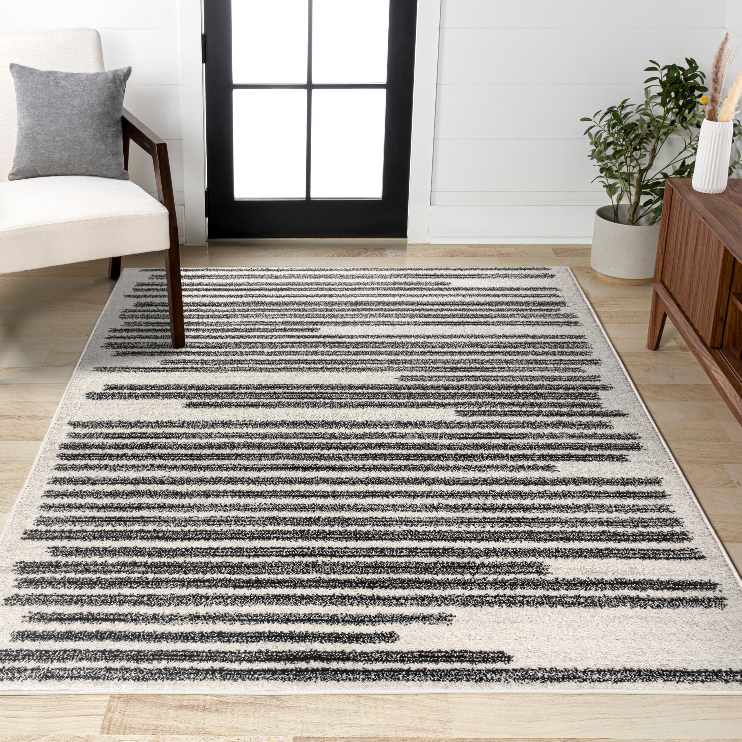 Jonathan Y Khalil stripe rug edge detail reveals crisp bar pattern on ivory backdrop