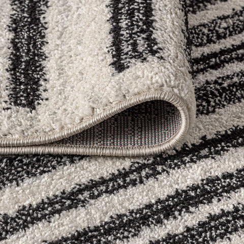 Jonathan Y Khalil stripe rug ivory and black palette suits neutral interiors