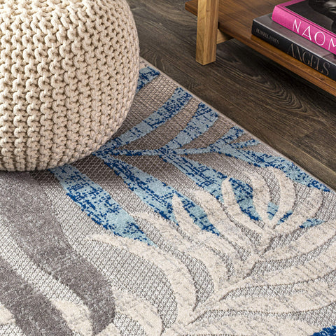 JONATHAN Y Tropics palm leaves rug 5x8 in gray-blue ready for high-traffic entryways.