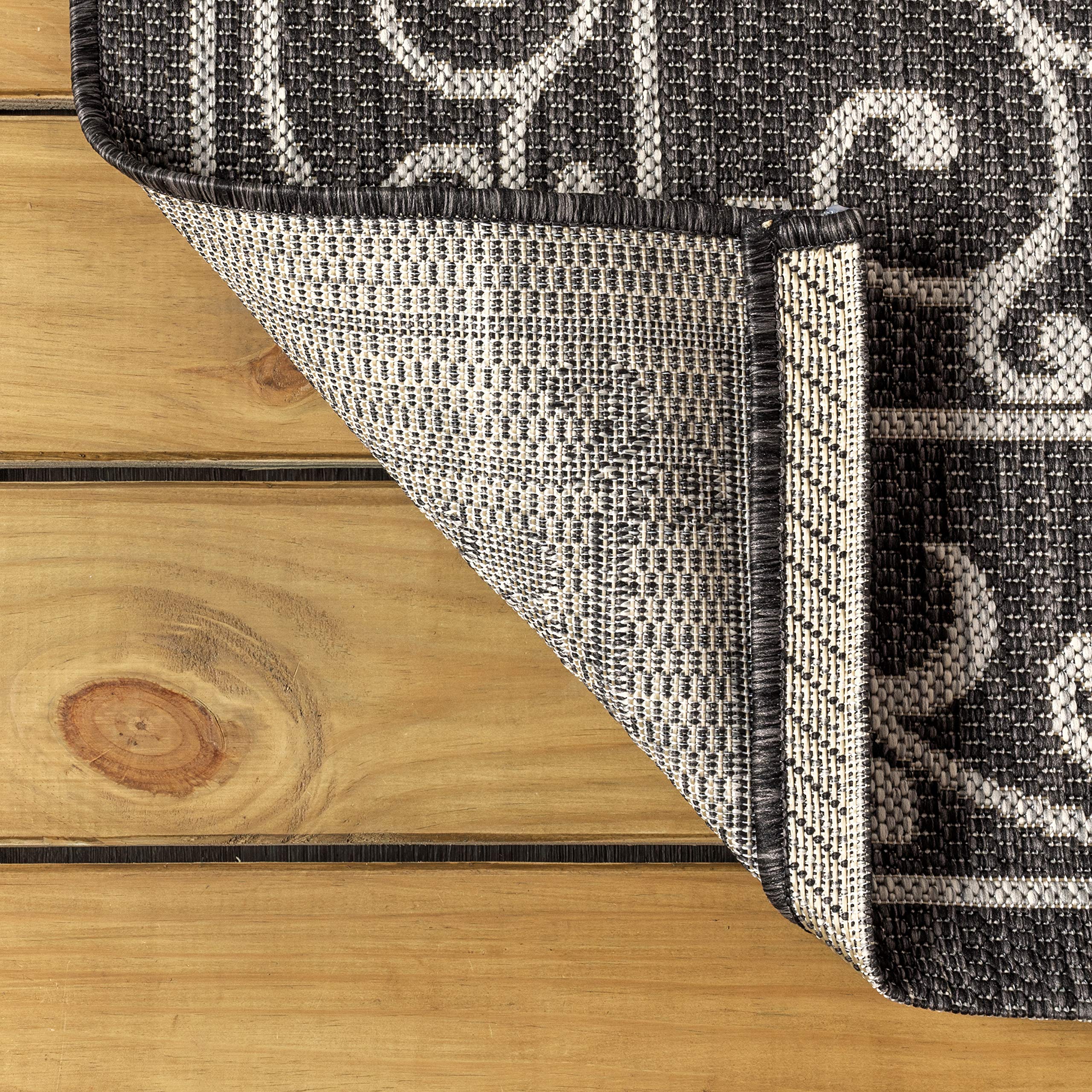 Jonathan Y 100% polypropylene rug, stain-resistant surface for quick cleanups on decks.