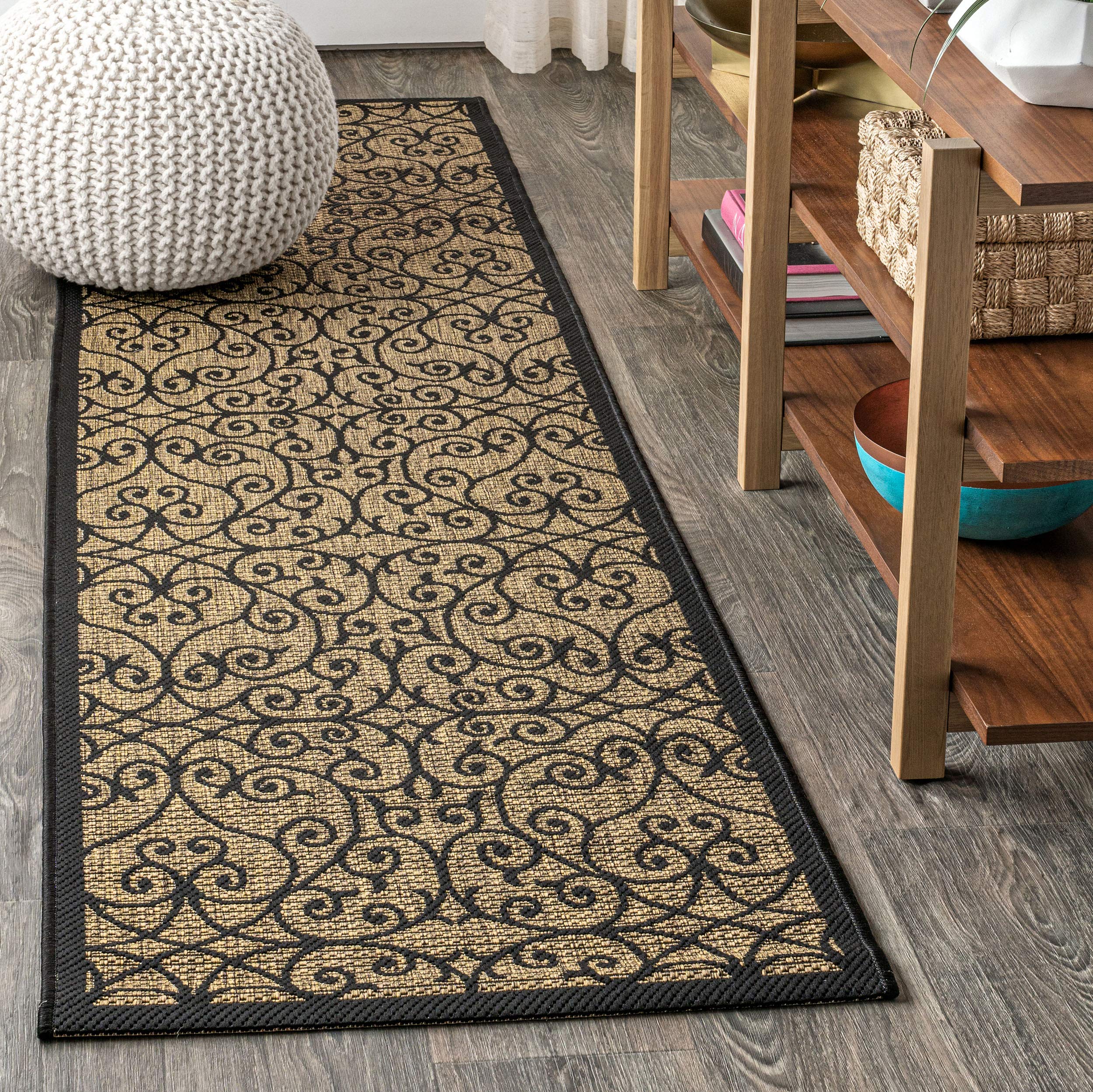 Jonathan Y Vintage Filigree runner on porch with black-khaki pattern; ideal for high-traffic outdoor areas.
