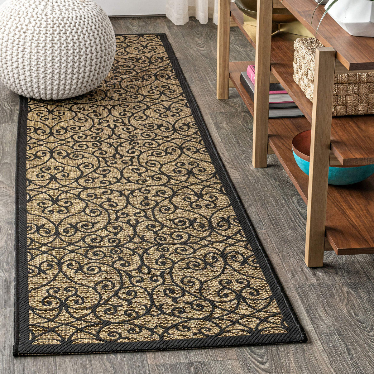 Jonathan Y Vintage Filigree runner on porch with black-khaki pattern; ideal for high-traffic outdoor areas.