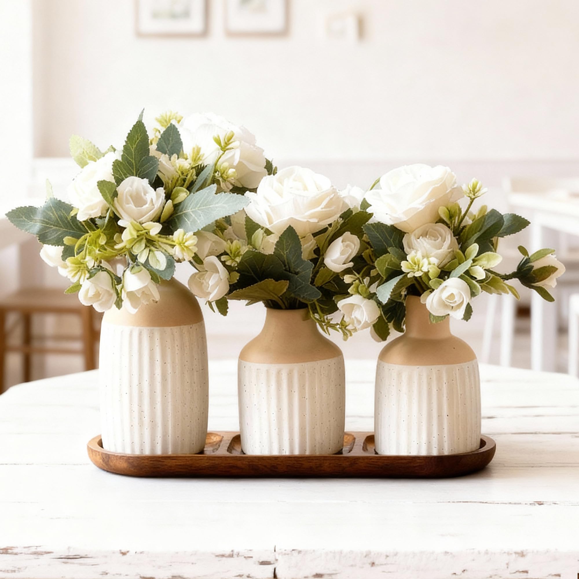 Jonronboci artificial flowers in ceramic vases with wood tray for a timeless centerpiece.