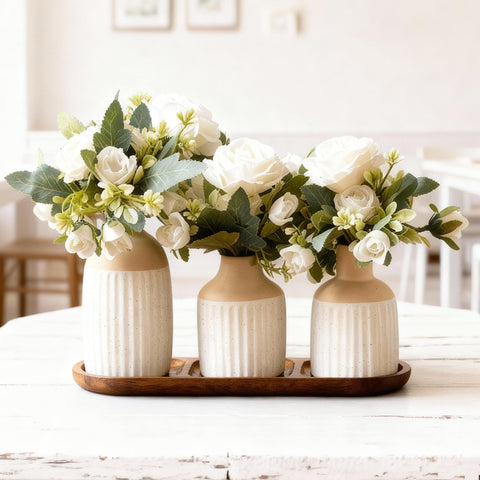 Jonronboci artificial flowers in ceramic vases with wood tray for a timeless centerpiece.