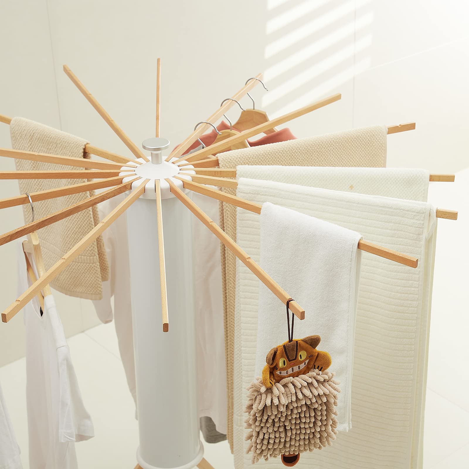 JOOM tripod with expanded arms accommodates more garments while saving space