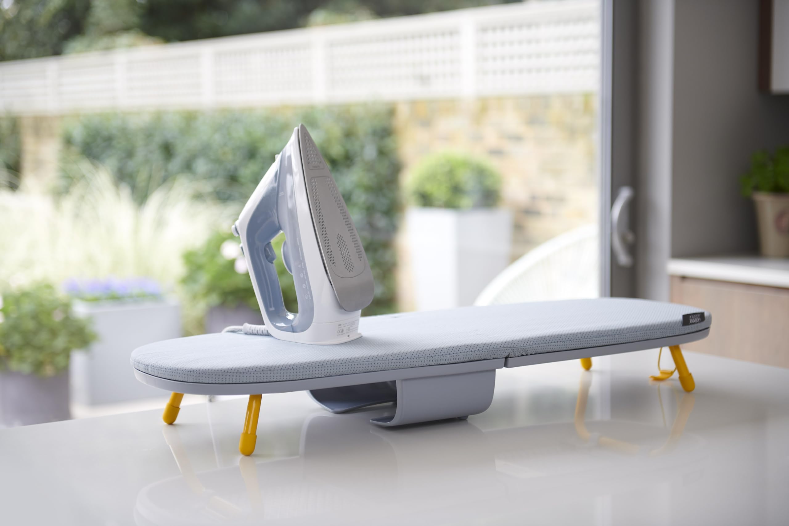Pocket Max ironing board with built in iron storage compartment keeps essentials organized
