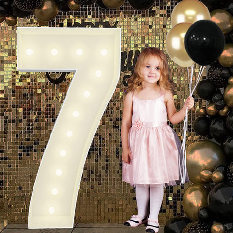 JoyBox Design 4ft marquee number 7 front view glows as a bold birthday centerpiece.