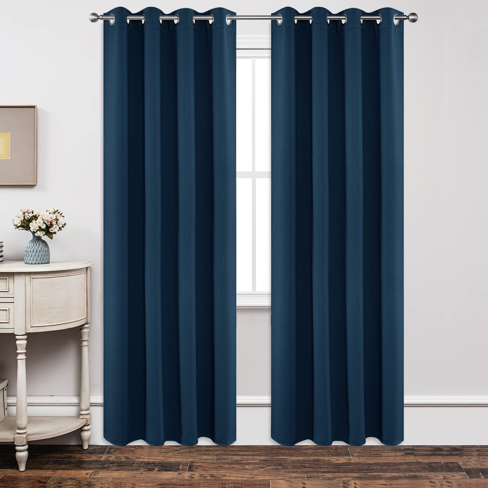 Joydeco navy blackout curtains block light for restful mornings.