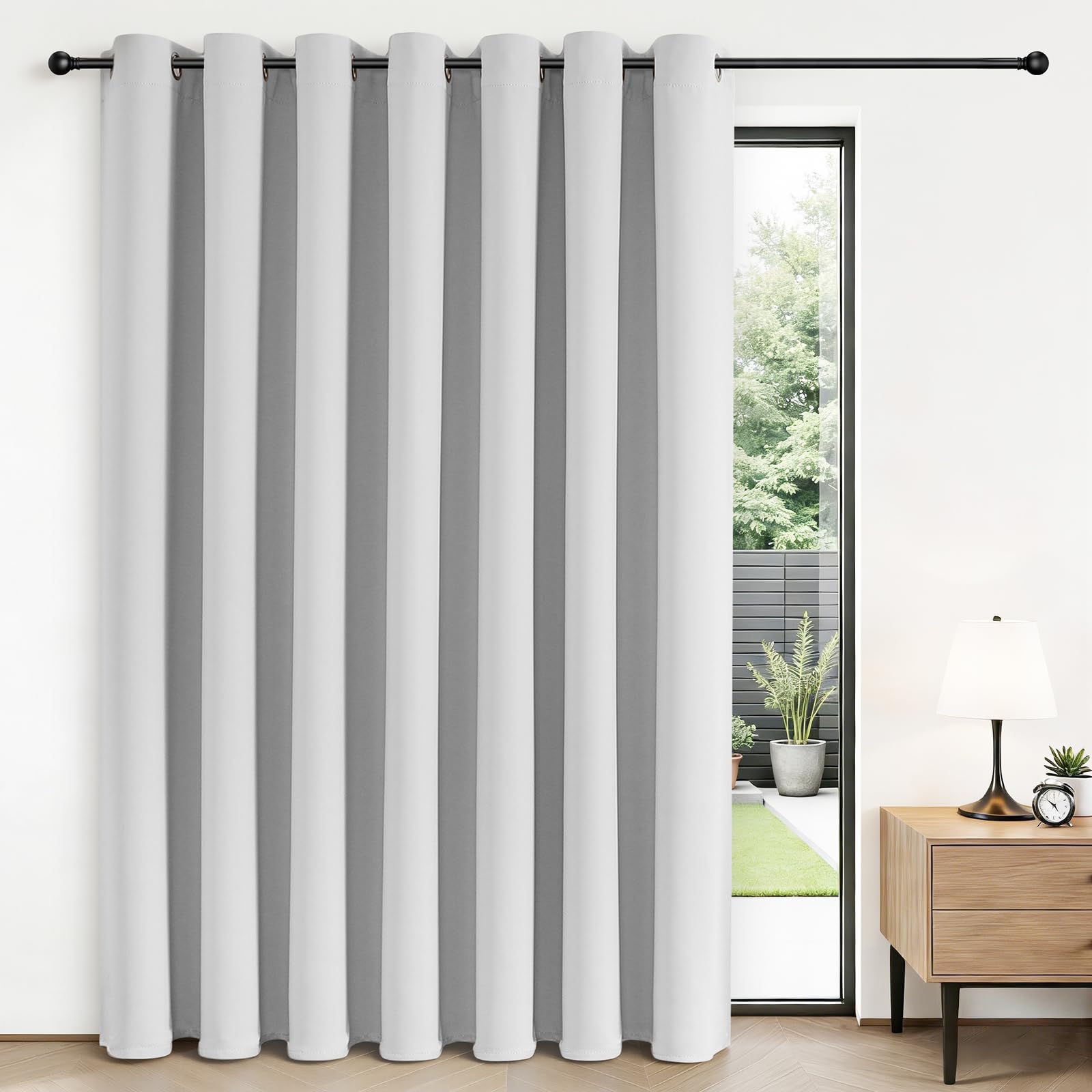 Joydeco blackout sliding door curtains in grayish white block sunlight and glare.