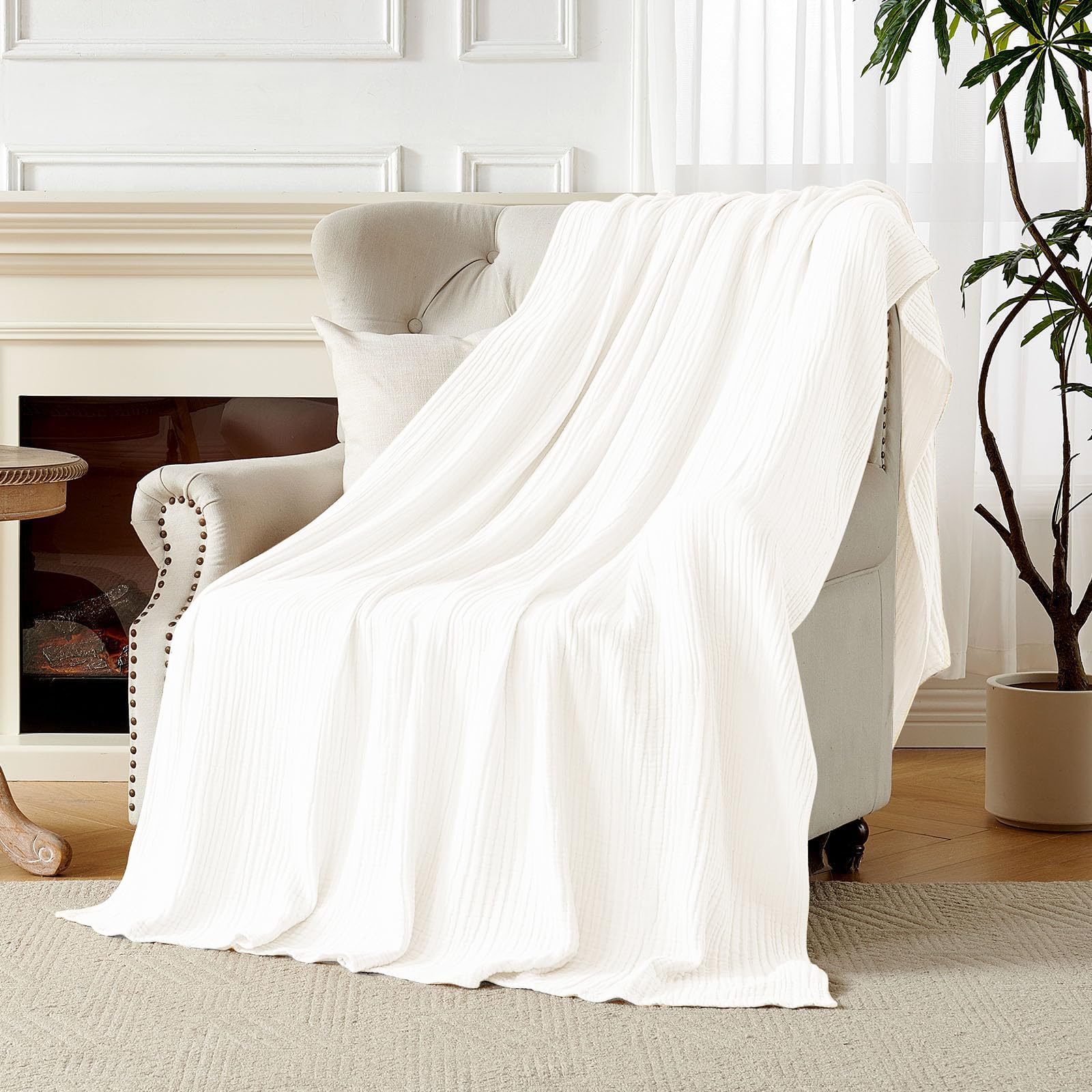 Gift-ready Joydeco muslin blanket scene suggests a thoughtful present.