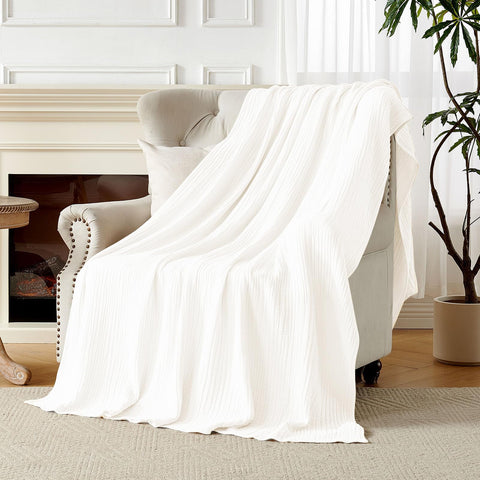 Gift-ready Joydeco muslin blanket scene suggests a thoughtful present.