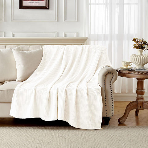 Joydeco muslin blanket ready for travel for year-round comfort.