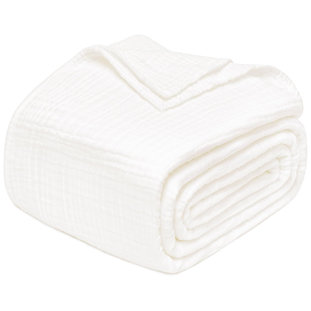 Joydeco muslin throw blanket on white sofa for breathable year-round comfort