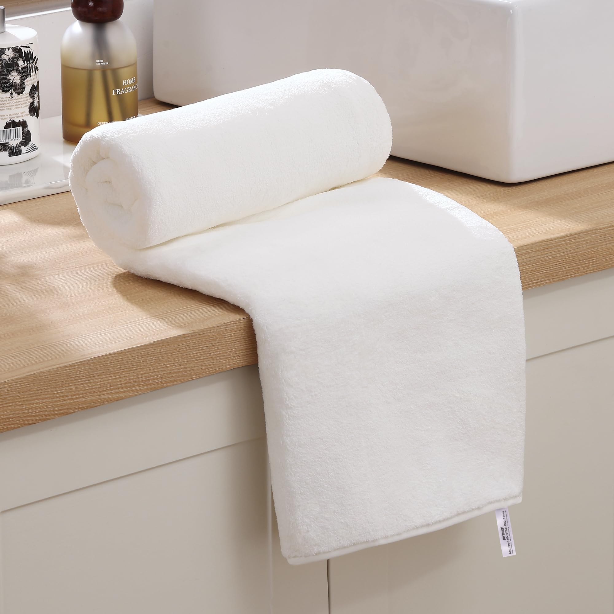 JOYMOOP bath towels quick-dry weave close-up shows plush softness.