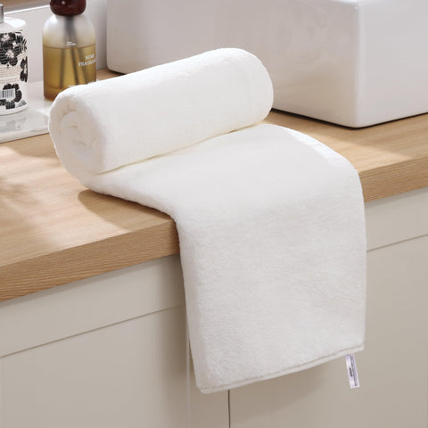 JOYMOOP bath towels quick-dry weave close-up shows plush softness.