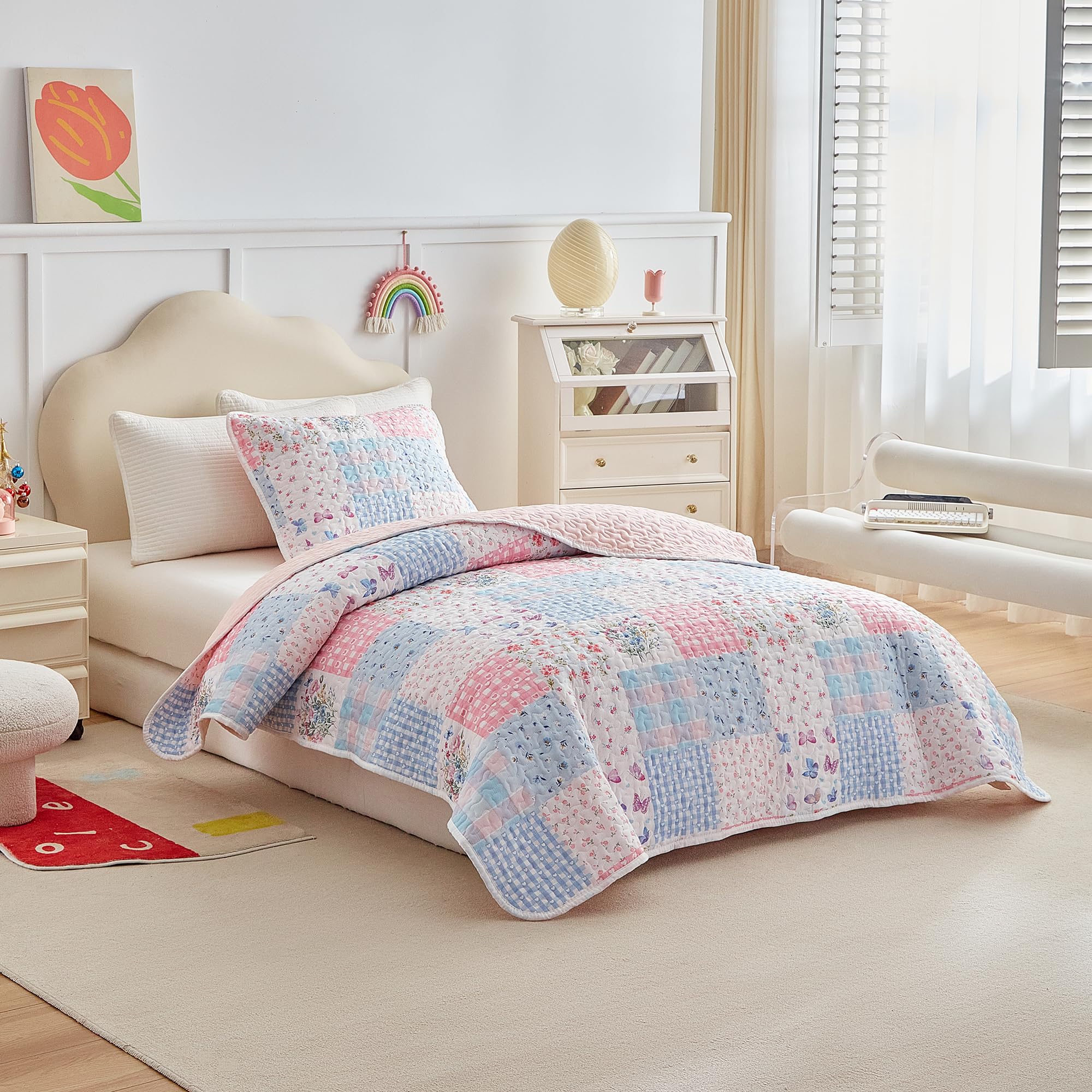 Joyreap quilt showing blush pink reverse for versatile styling