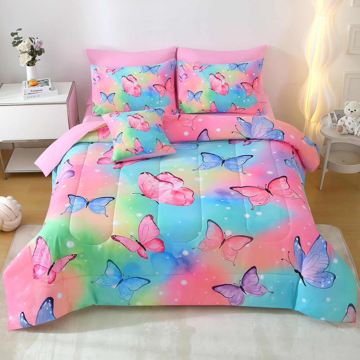 JQinHome twin rainbow butterfly comforter set in full color on a bed.