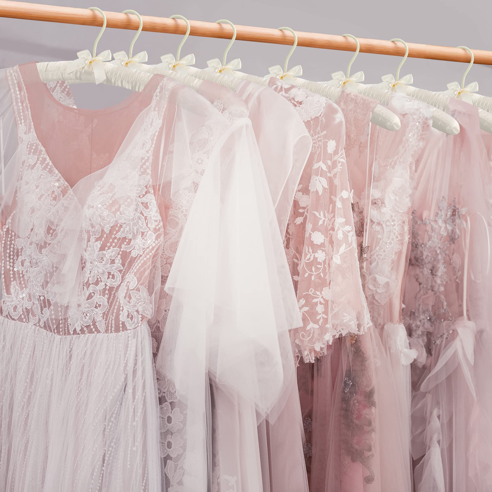 JS HANGER satin-covered hanger reduces snags and protects delicate fabrics.
