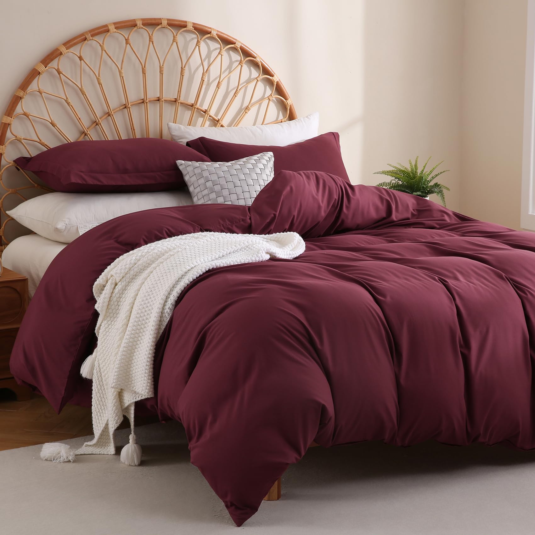 Crisp burgundy shade drapes evenly with wrinkle resistance on bed