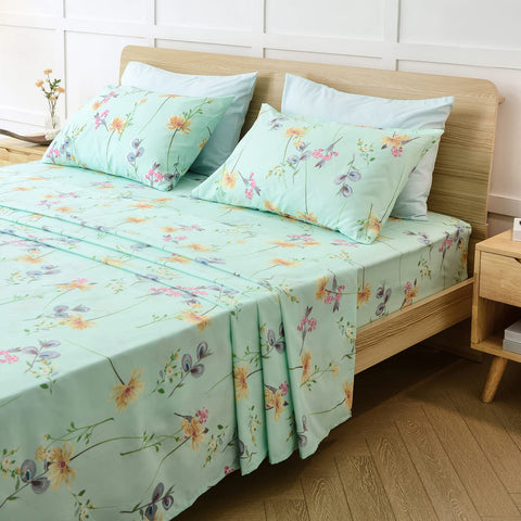 JSD Green Floral Queen bedroom ambience with fresh greens and inviting fabric texture.