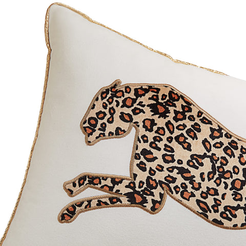 Juicy Couture pillow on sofa display for instant glam