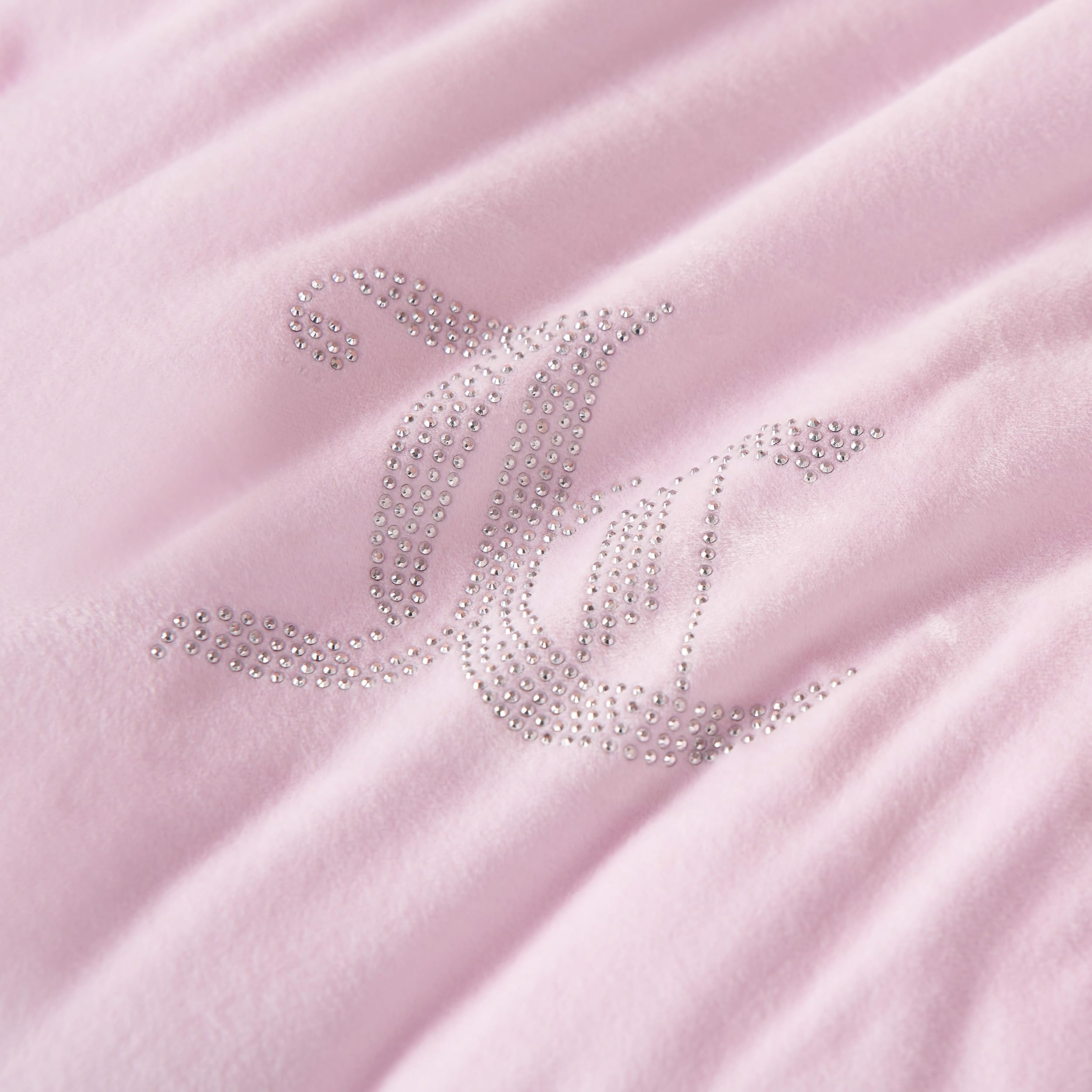 Juicy Couture velour fabric close-up highlighting soft texture and inviting warmth