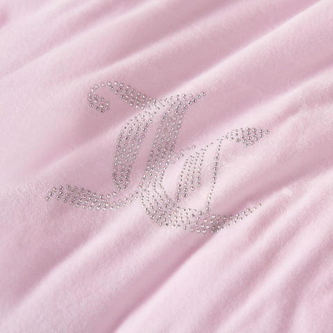 Juicy Couture velour fabric close-up highlighting soft texture and inviting warmth