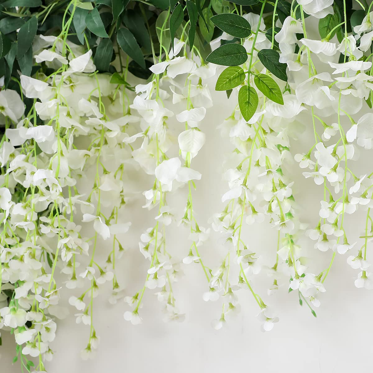 JUSTOYOU three-pack garland offers generous length for wedding aisles and windows.