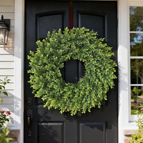 Juxdp boxwood wreath close-up shows lifelike texture and faux twigs.