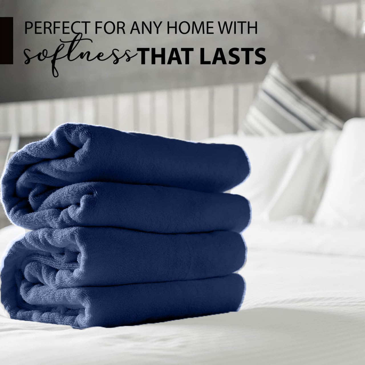 KAHAF COLLECTION navy towel draped over rod highlights luxury feel and quick moisture pickup.