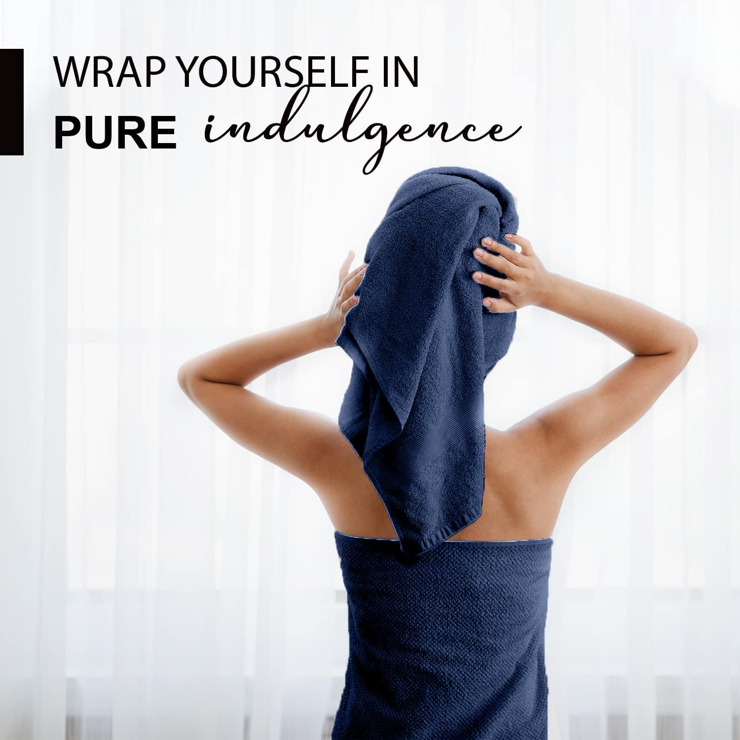 KAHAF COLLECTION navy towel folded stack demonstrates generous 24x48 size for home or gym.