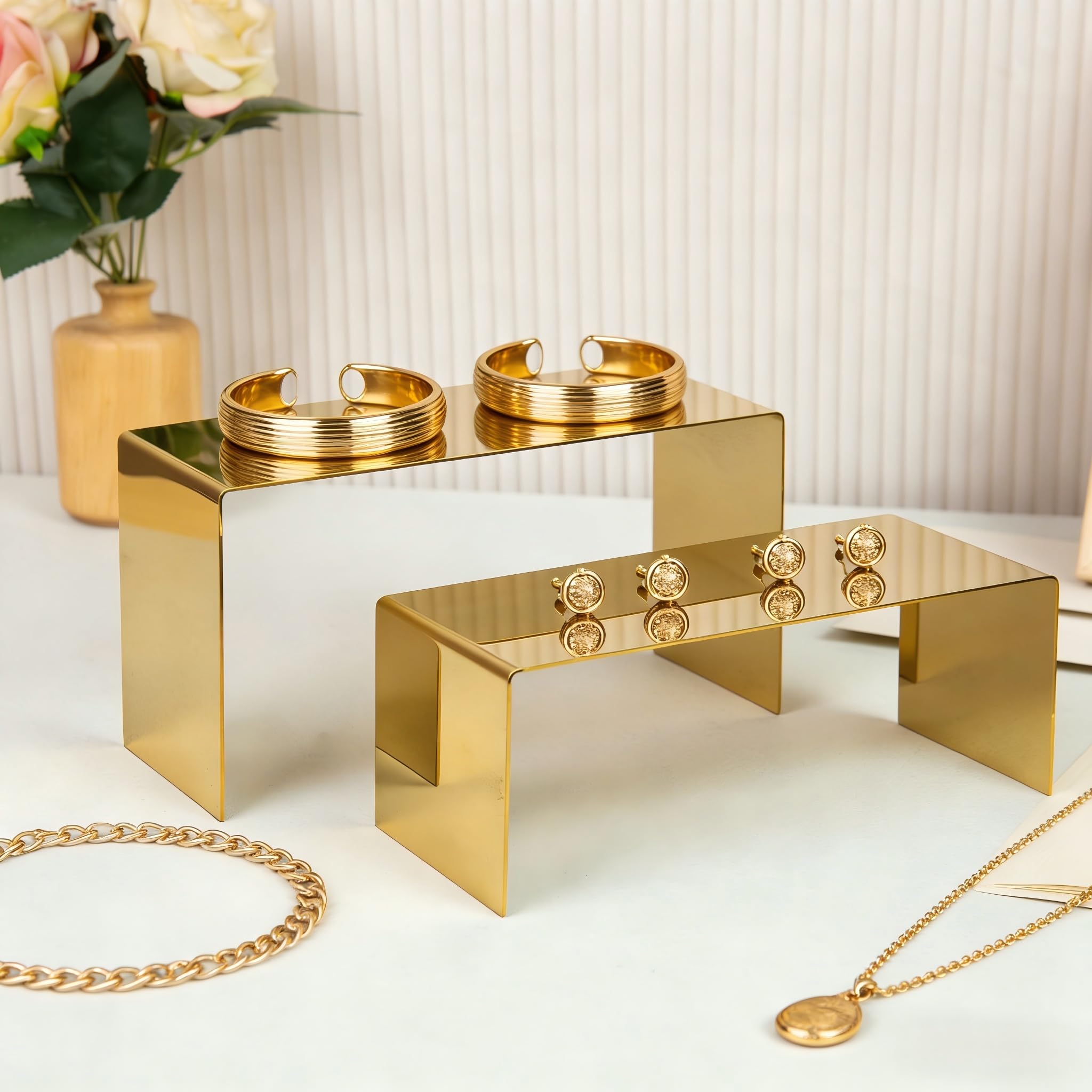 KAIDIYIN perfume display on gold risers draws attention to scents.