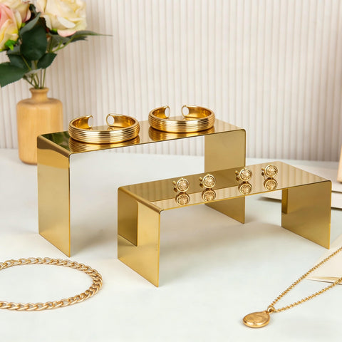 KAIDIYIN perfume display on gold risers draws attention to scents.