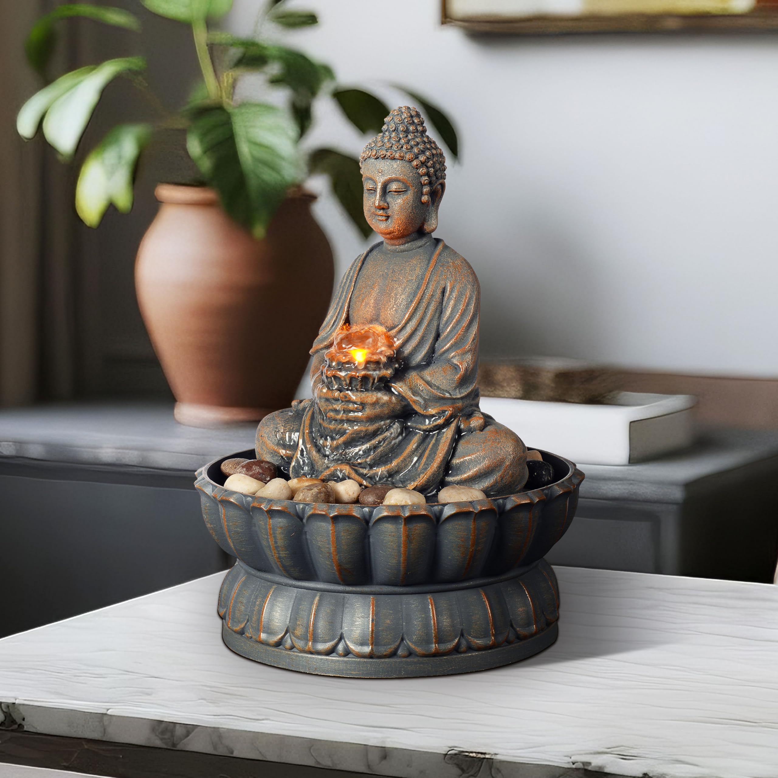 Kalona Buddha fountain complements modern interiors with subtle cobble accents.