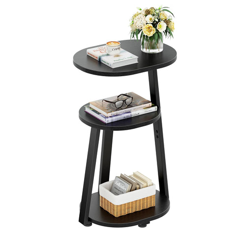 Kalrin oval bedside table supporting lamp and books neatly.