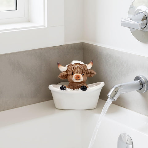 Karenhi Highland cow decor on a desk tray inspires rustic table styling.