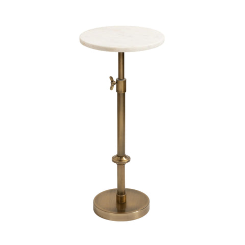 Kate and Laurel Engles marble top pedestal table beside sofa, offering a refined surface.