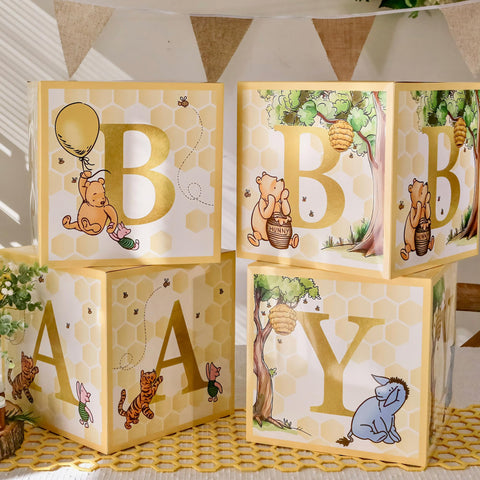 Kate Aspen bear decor for gender reveal with soft yellows and sweet honeycomb accents