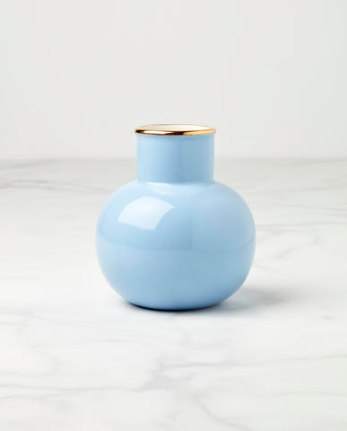 kate spade new york blue Make It Pop small vase on a shelf with gold accents