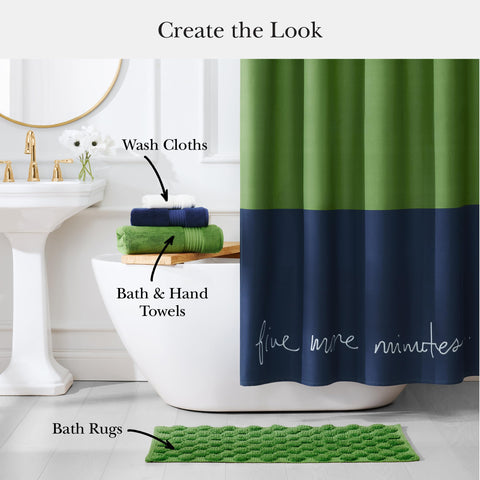 kate spade new york blue green color block design enhances bath decor.