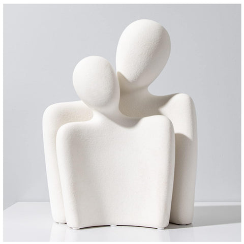 Katoonx hugging couple statue in white ceramic adds a romantic focal point to any shelf or table.