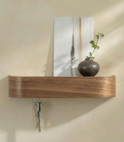 Kazai Toke wall mount key holder with walnut veneer enhances entryway organization.