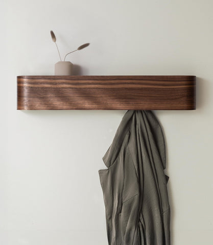 Kazai Toke wall-mounted coat rack with hidden hooks in walnut, organized entryway solution.