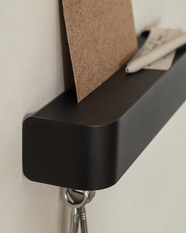 Kazai Tone metal shelf adds handy space for keys and small items.