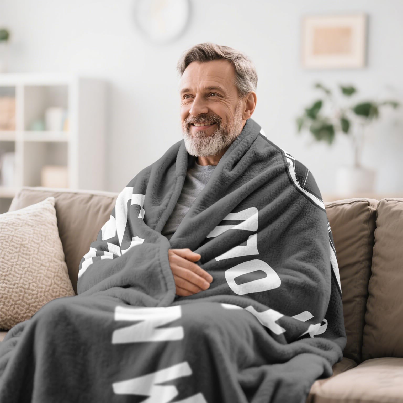 Kazdan 50x60 inch blanket shown on a couch for cozy lounging.