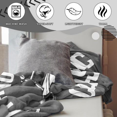 Kazdan travel-friendly throw folded for on-the-go warmth.